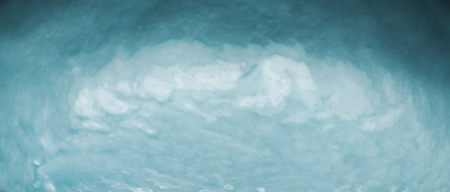 a texture of light blue and turquoise colour forming a concave arch