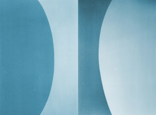 sky blue and turquoise textures divided by their opposing colours forming an hourglass-like shape in the center of the image.